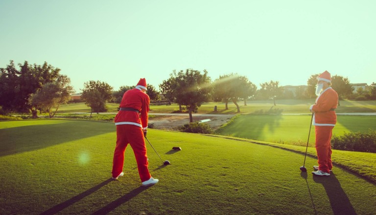 Golfen Weihnachtsmänner